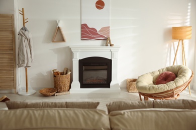Bright living room interior with fireplace and papasan chair