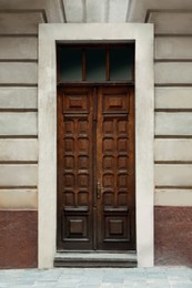 Photo of View of building with vintage wooden door. Exterior design