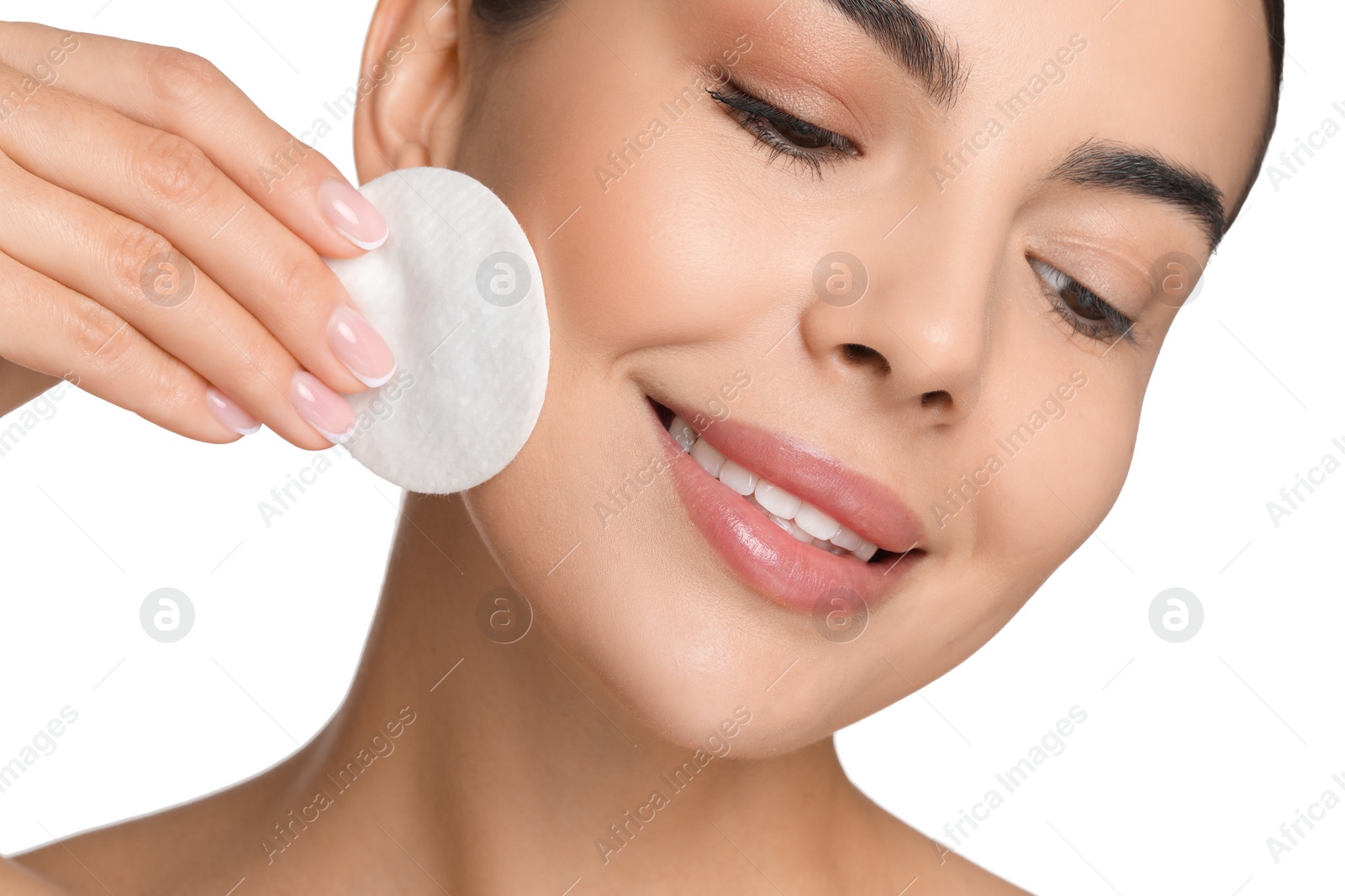 Photo of Beautiful woman removing makeup with cotton pad on white background, closeup