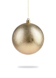 Image of Beautiful golden Christmas ball hanging on white background