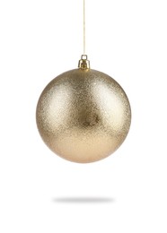 Beautiful golden Christmas ball hanging on white background