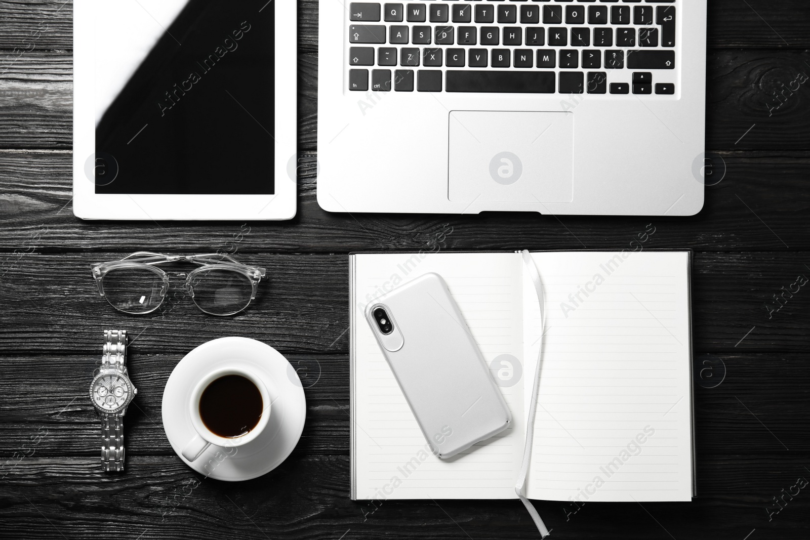 Photo of Flat lay composition with laptop and notebook on wooden table, space for text. Blogger's workplace