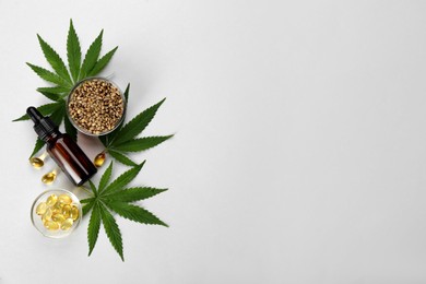 Flat lay composition with CBD oil or THC tincture and hemp leaves on light background, space for text