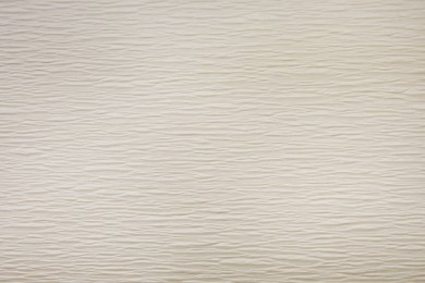 Texture of beige paper as background, closeup view