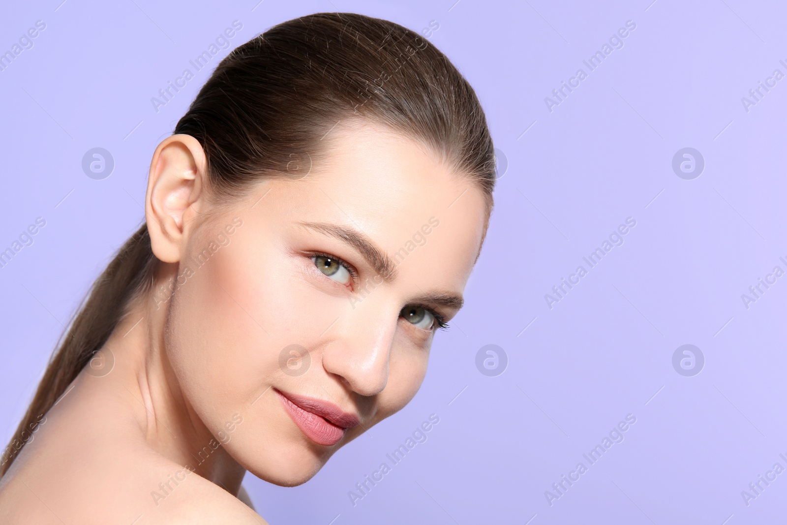 Photo of Beautiful woman with perfect eyebrows on color background