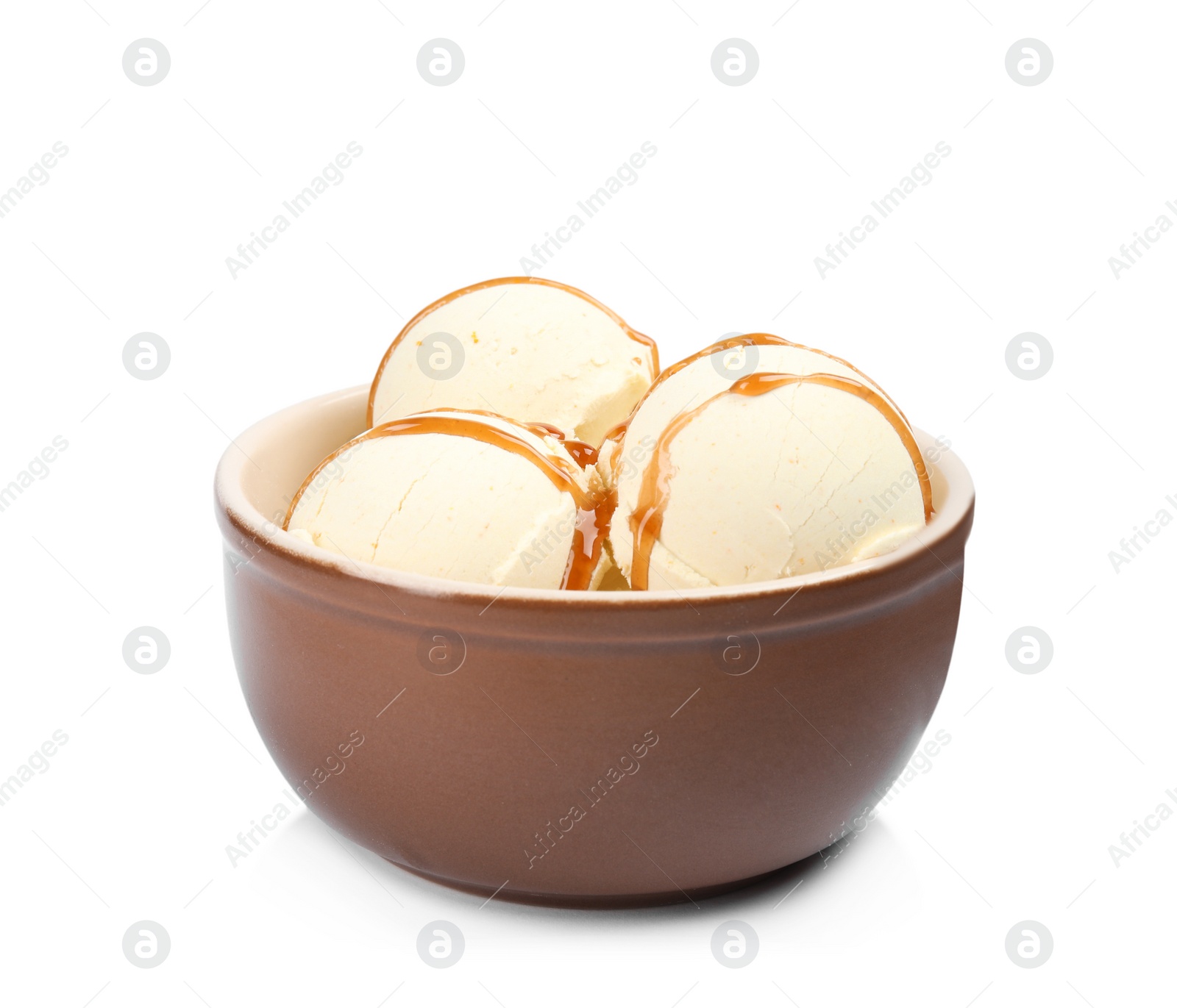 Photo of Delicious ice cream with caramel sauce in bowl on white background