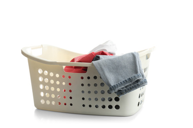 Photo of Laundry basket with clothes isolated on white