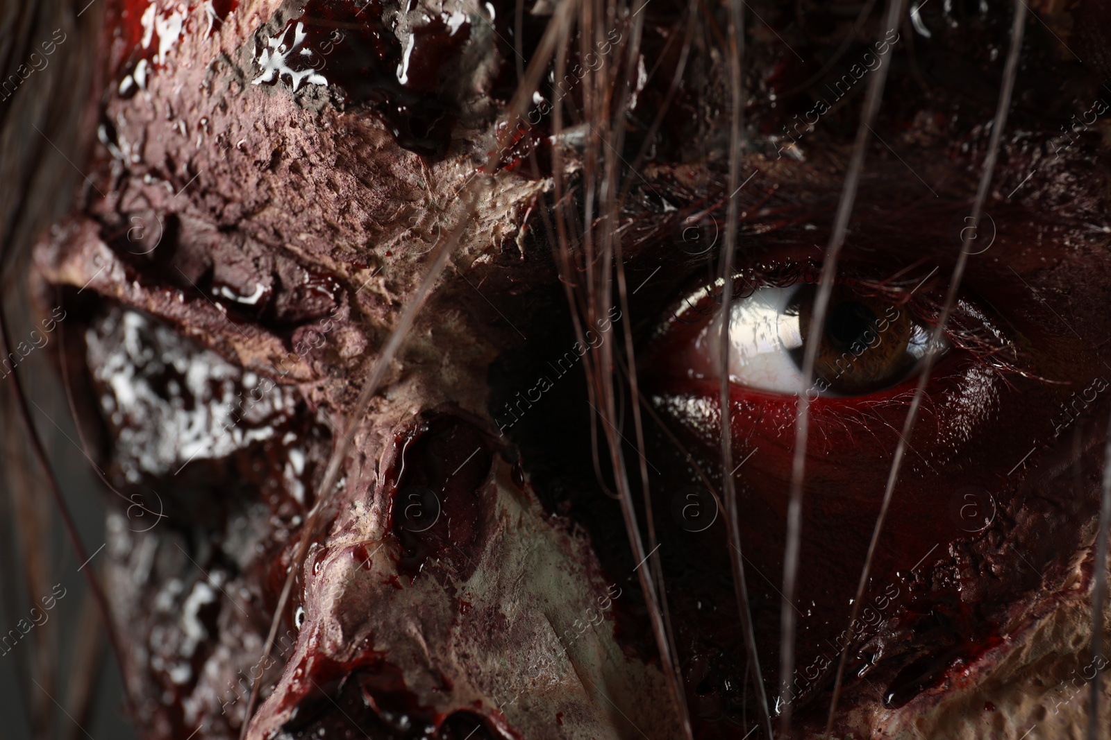 Photo of Closeup view of scary zombie. Halloween monster