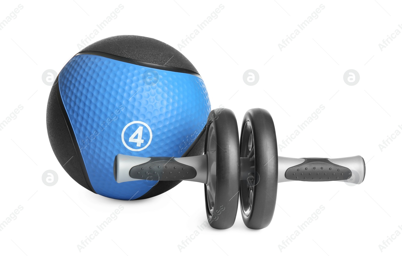 Photo of Medicine ball and abdominal wheel on white background
