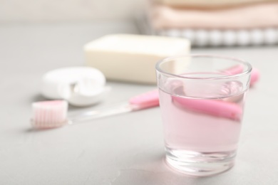 Set of oral care products on light table, closeup. Teeth hygiene