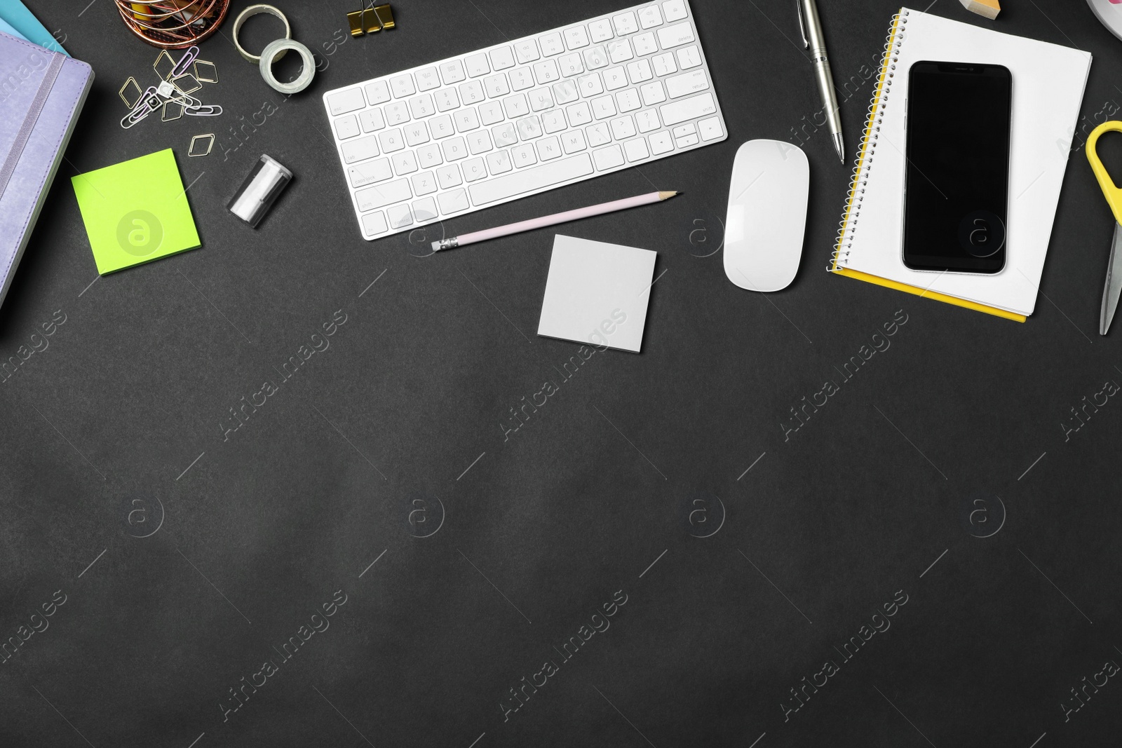 Photo of Flat lay composition with keyboard, smartphone and stationery on black background, space for text. Designer's workplace