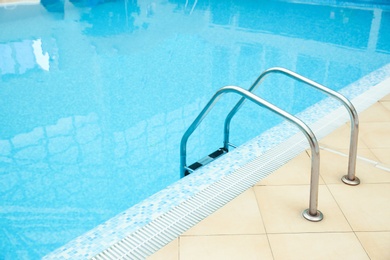 Photo of Ladder with grab bars in swimming pool