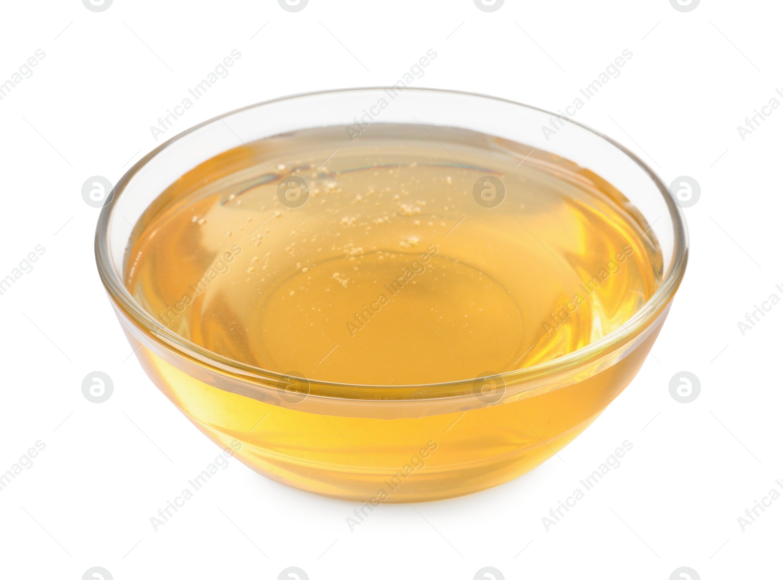 Photo of Tasty honey in bowl isolated on white