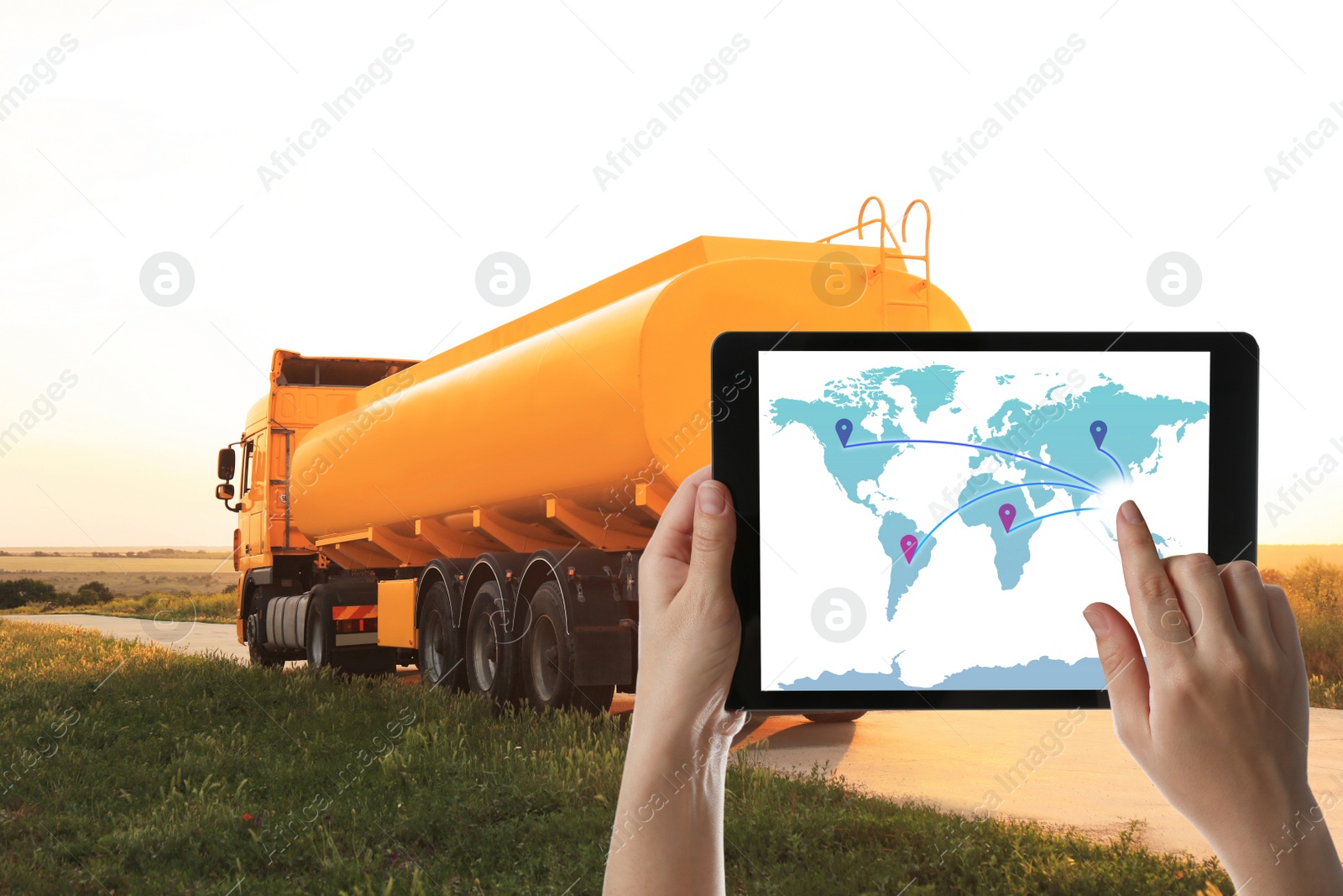 Image of Logistics concept. Woman using tablet with world map on screen against truck