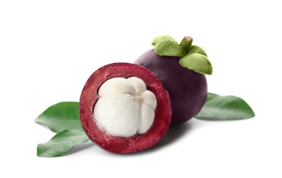 Fresh mangosteen fruits with green leaves on white background