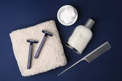 Flat lay composition with shaving accessories for men on blue background