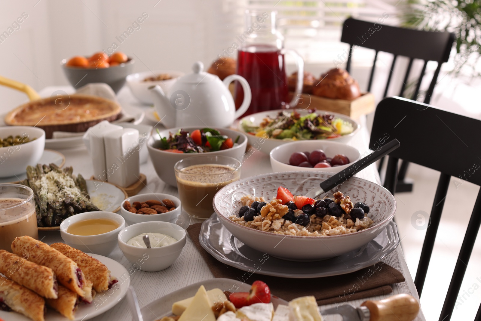 Photo of Many different dishes served on buffet table for brunch