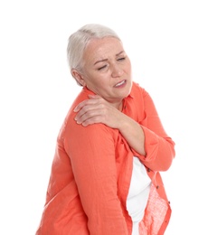 Woman suffering from shoulder pain on white background