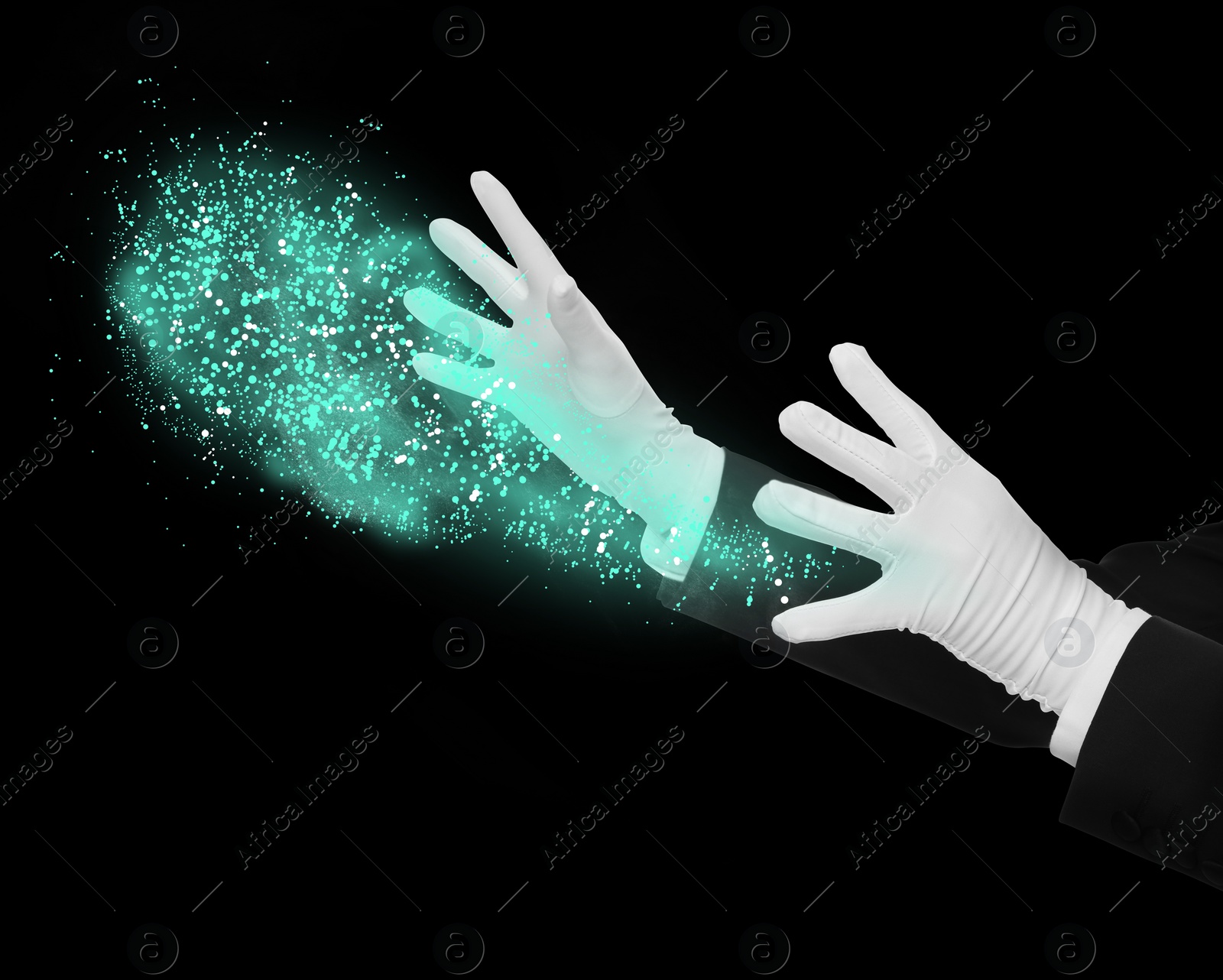 Image of Magician performing magic trick on black background, closeup