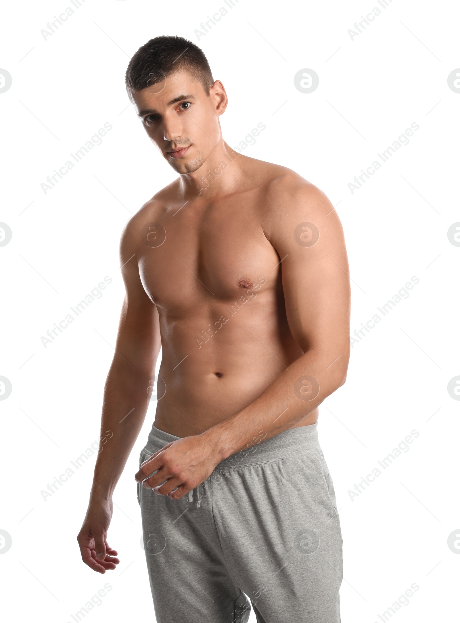 Photo of Young man with slim body on white background