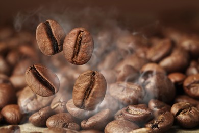 Image of Aromatic roasted coffee beans and steam, closeup