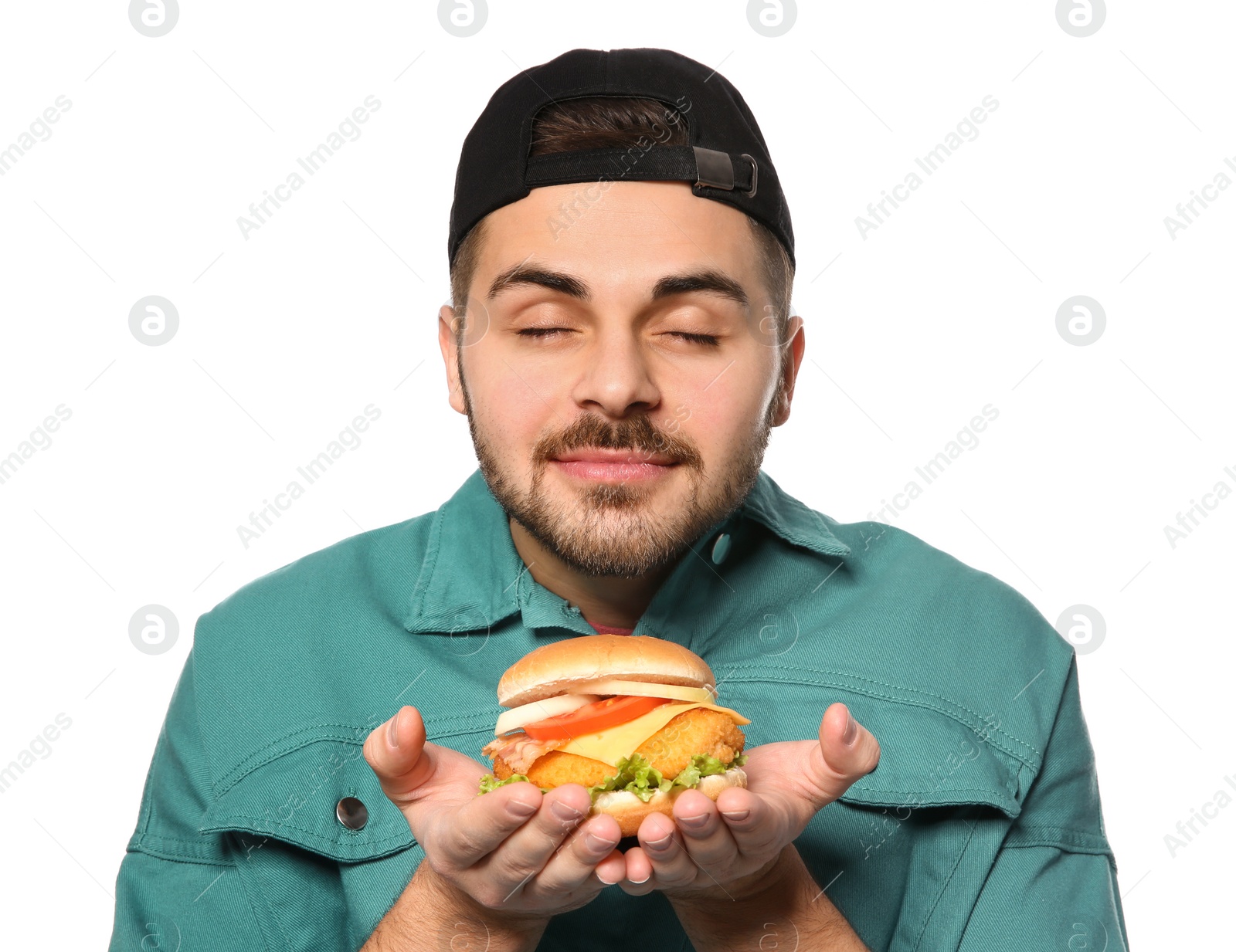 Photo of Handsome man with tasty burger isolated on white