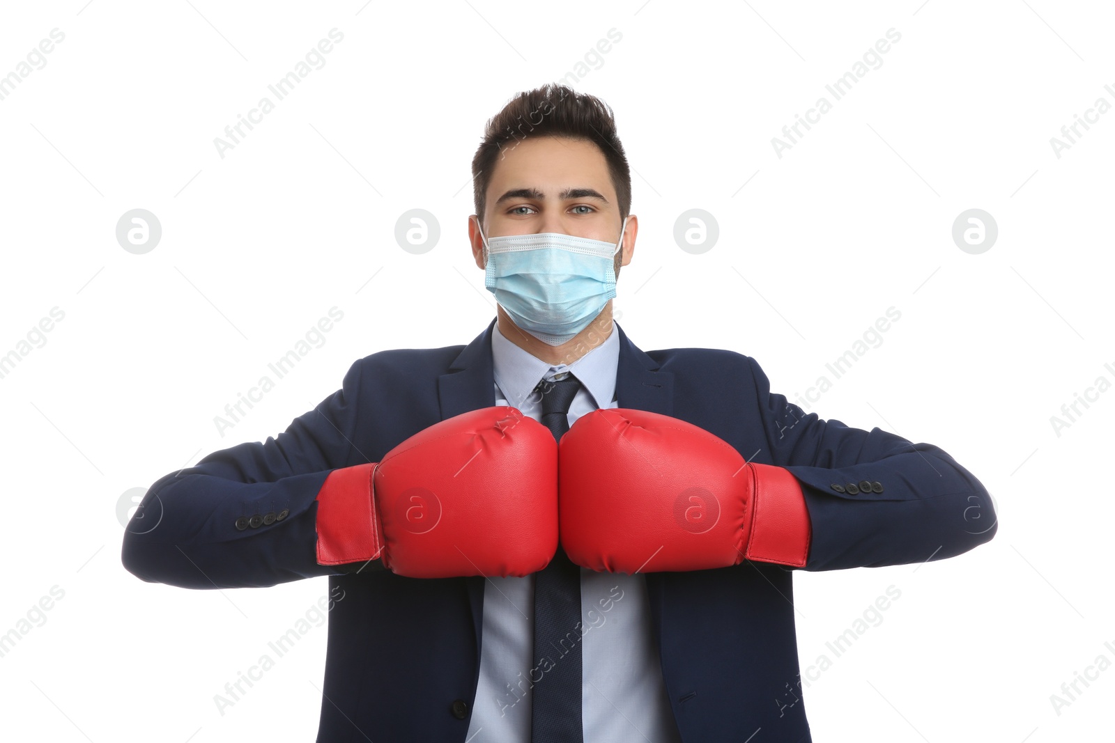 Photo of Businessman with protective mask and boxing gloves on white background. Strong immunity concept