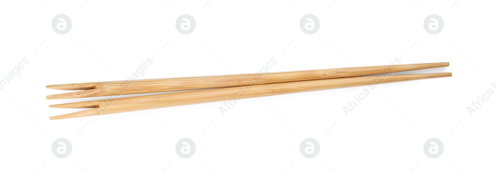 Photo of Pair of wooden chopsticks isolated on white, top view