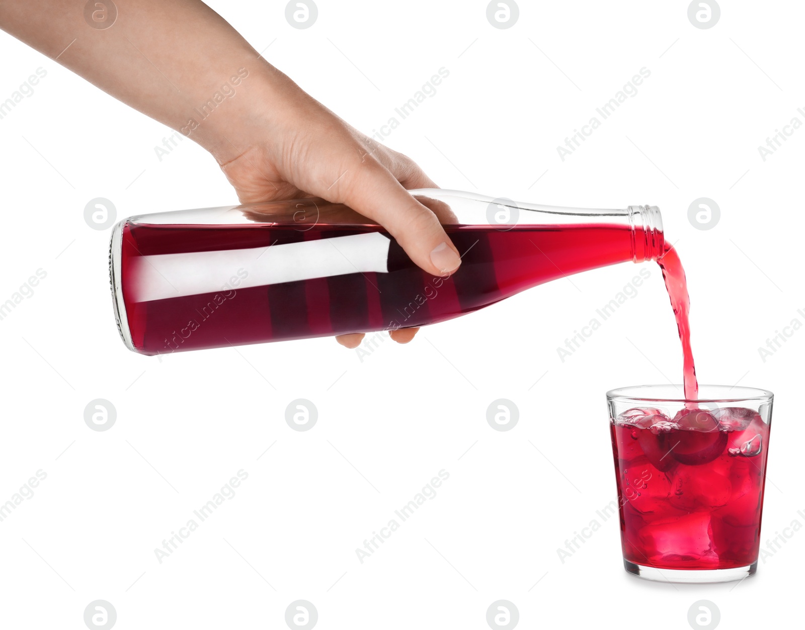 Photo of Woman pouring grape soda water into glass on white background, closeup. Refreshing drink