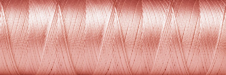 Image of Texture of rose gold thread, closeup view. Banner design