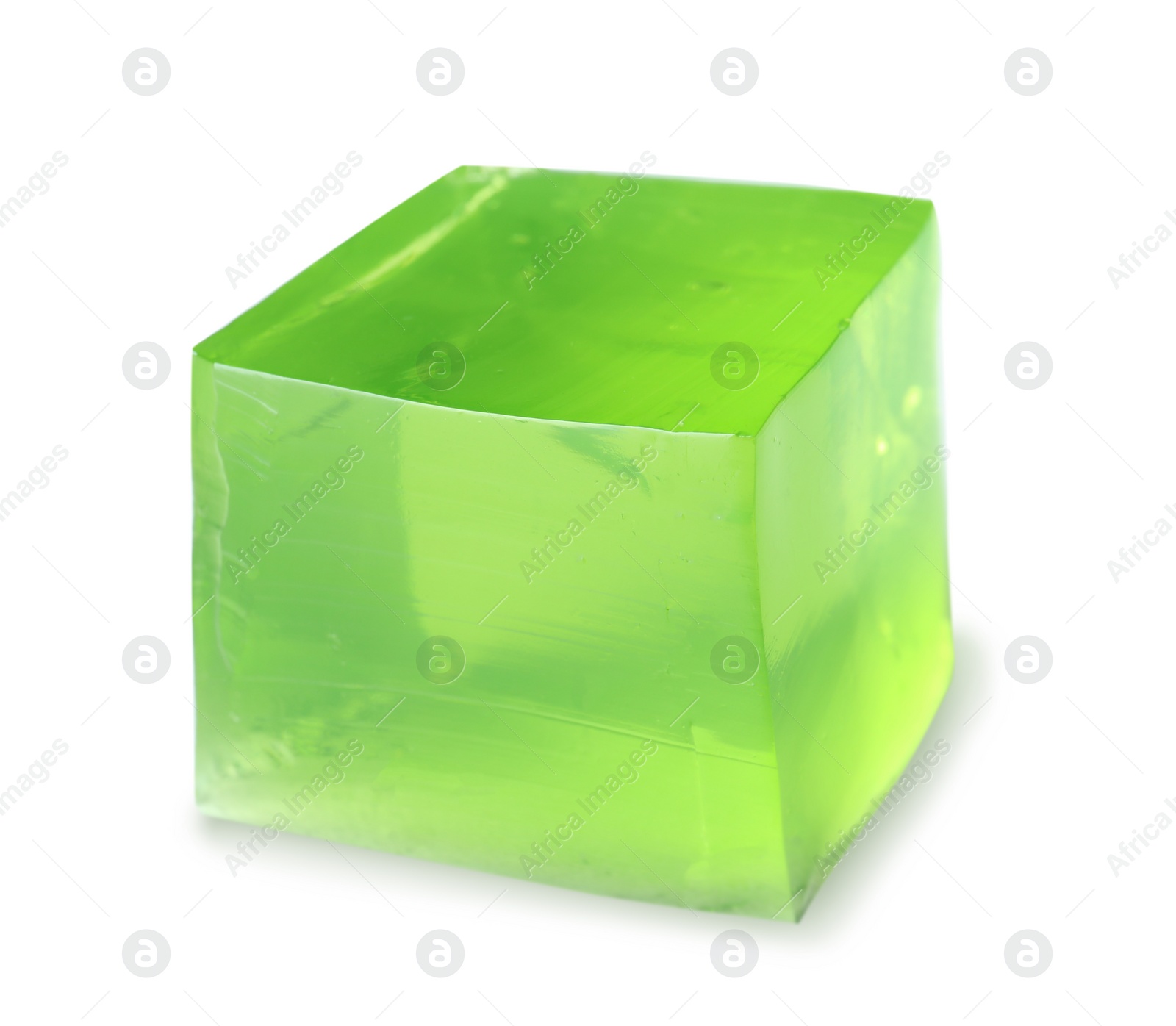 Photo of Delicious green jelly cube on white background