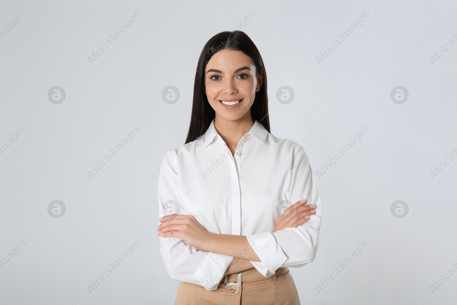 Photo of Portrait of young businesswoman on white background