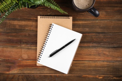 Flat lay composition with office stationery on wooden table