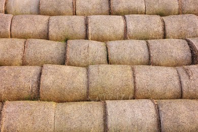 Many hay bales as background, closeup view