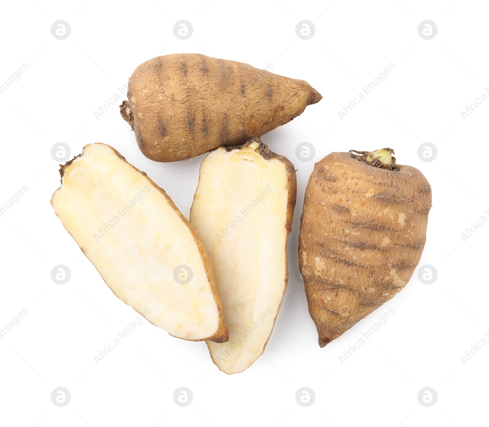 Photo of Whole and cut tubers of turnip rooted chervil isolated on white, top view