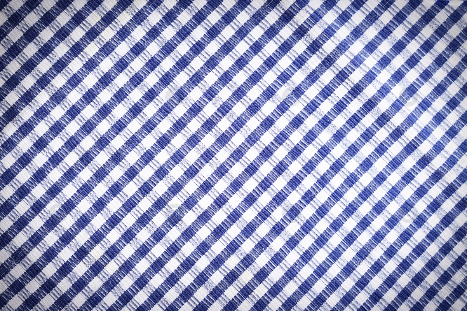 Image of Blue and white tablecloth as background, vignette effect