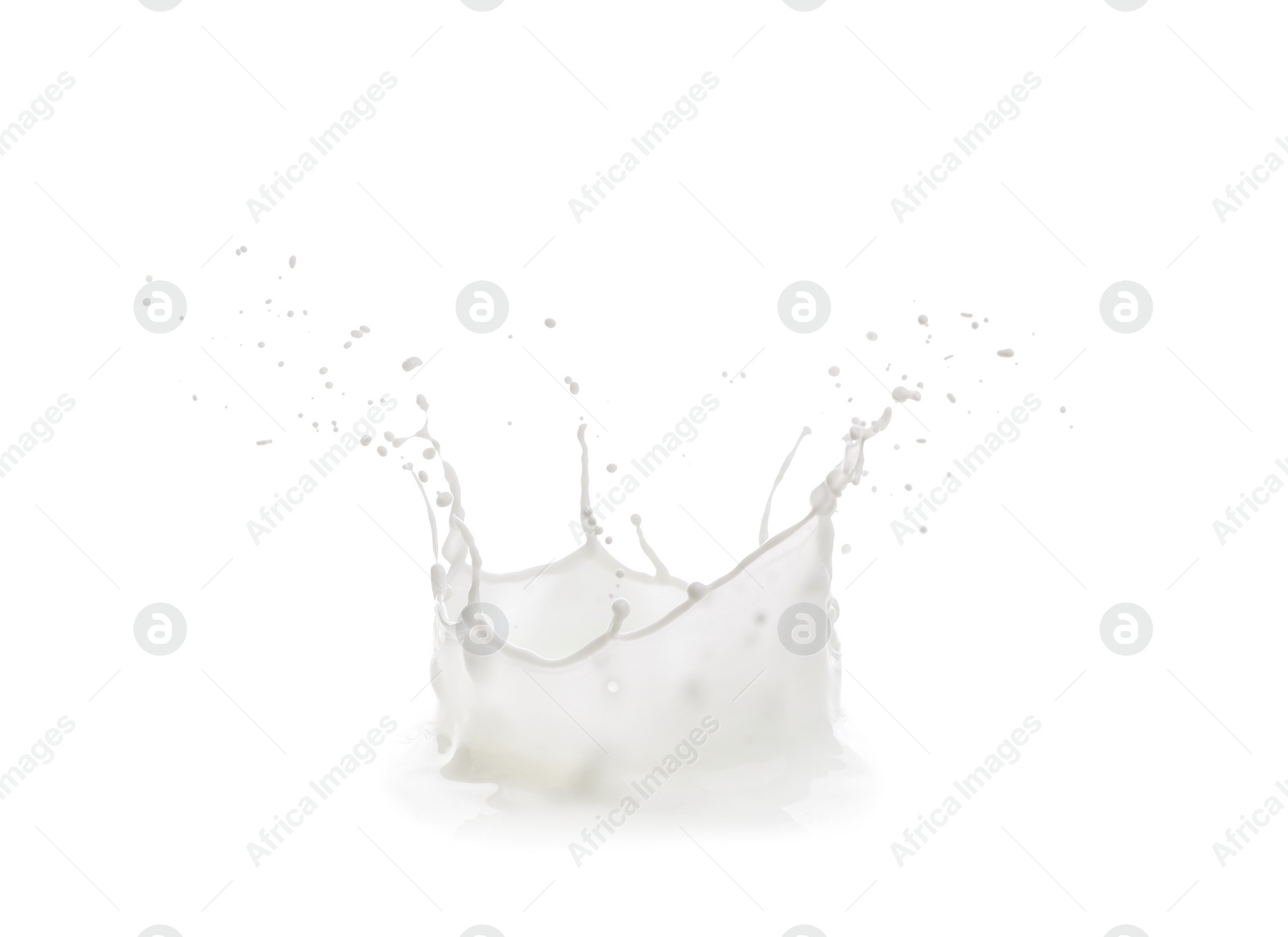 Photo of Splash of fresh milk on white background