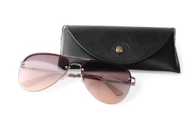 Stylish sunglasses and black leather case on white background