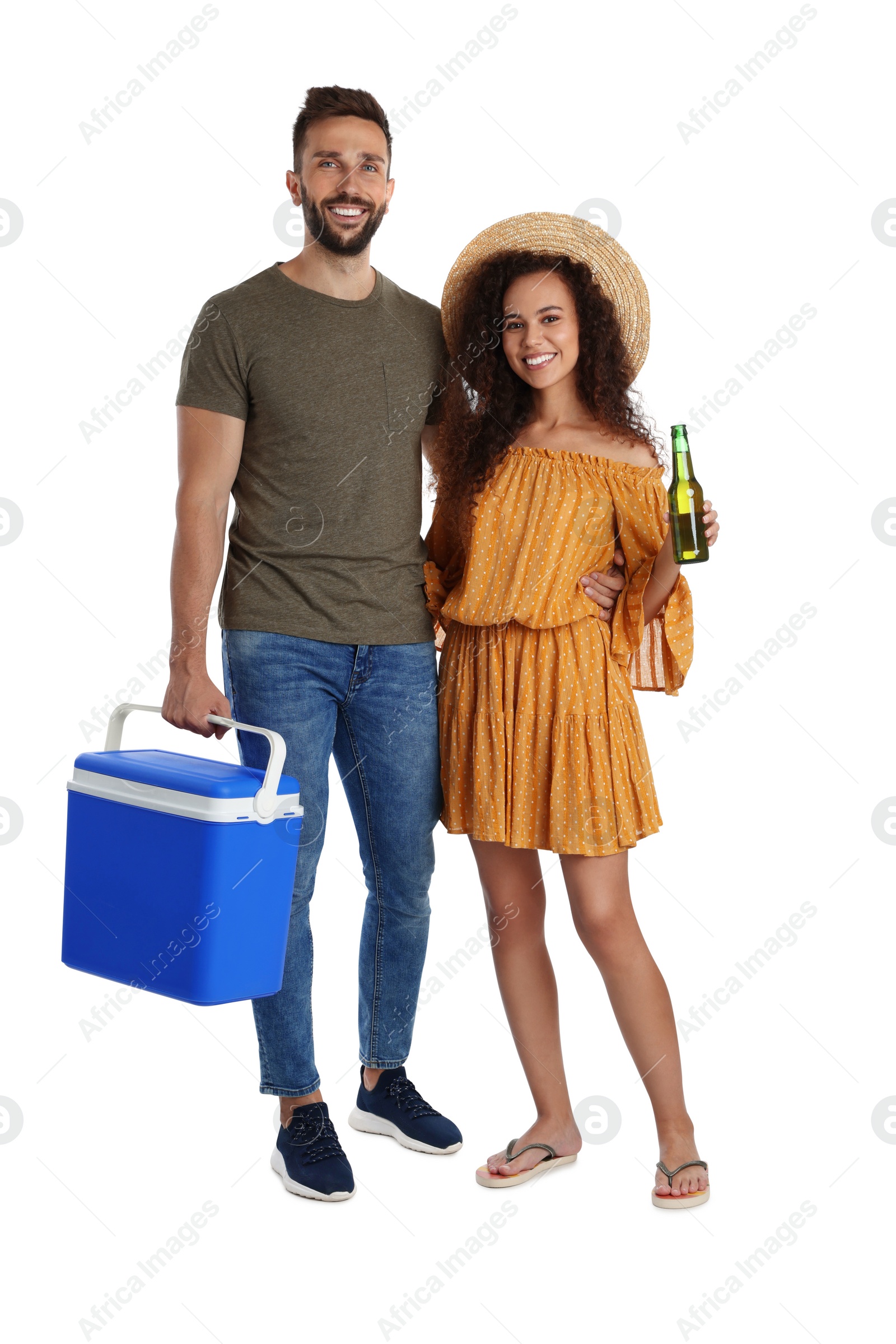 Photo of Happy couple with cool box and bottle of beer on white background