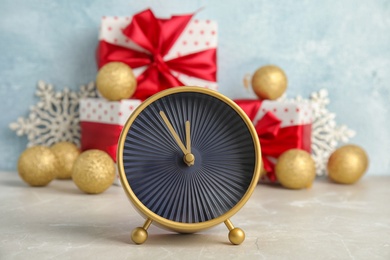 Alarm clock, gifts and decorations on table. Christmas countdown