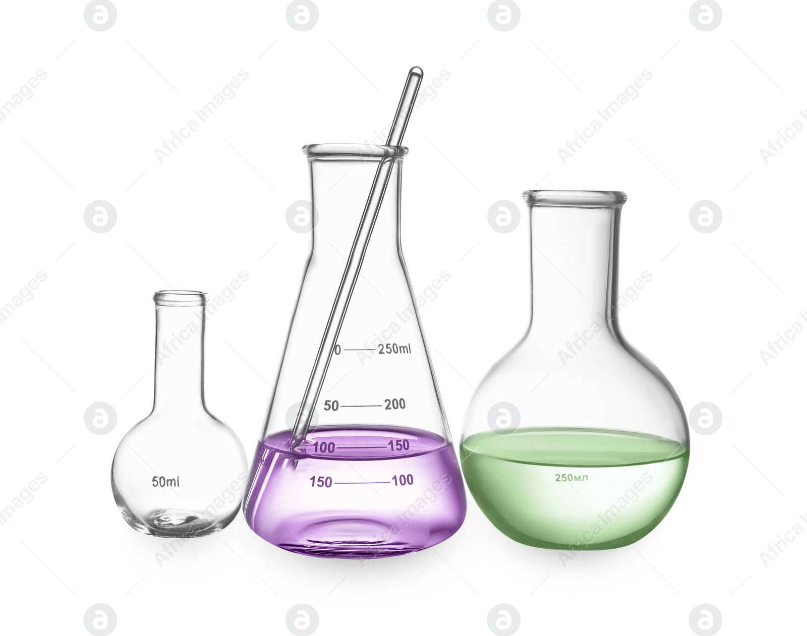 Image of Glass flasks with colorful liquids and stirring rod isolated on white