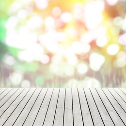 Image of Empty wooden surface against blurred background. Bokeh effect