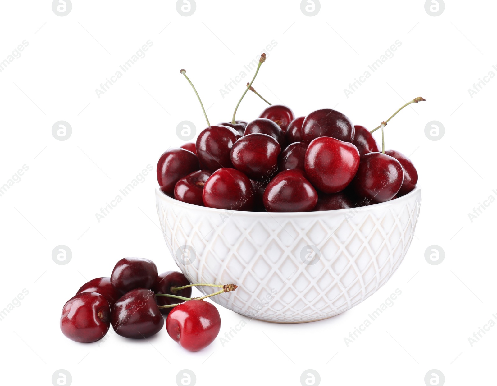 Photo of Tasty ripe red cherries and bowl isolated on white