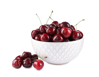 Photo of Tasty ripe red cherries and bowl isolated on white