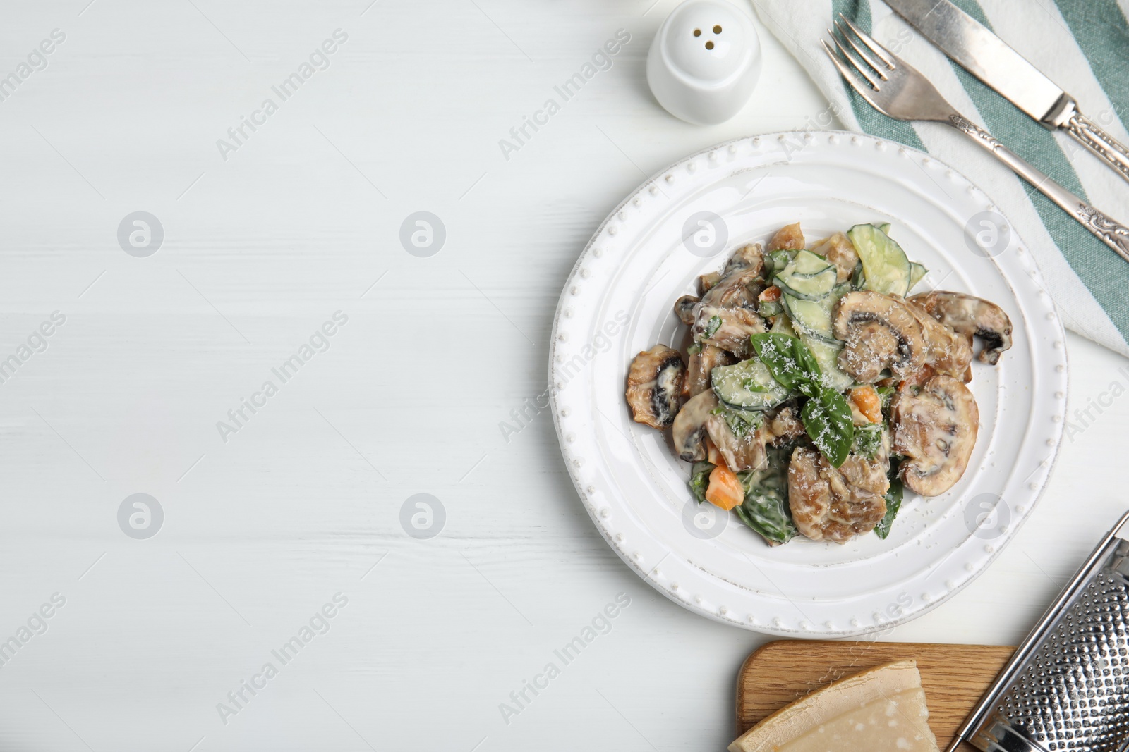 Photo of Delicious salad with mayonnaise on white table, flat lay. Space for text