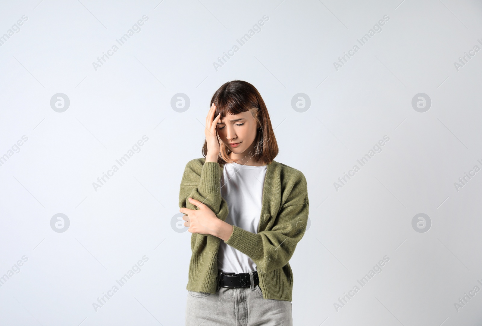 Photo of Portrait of stressed young girl on white background