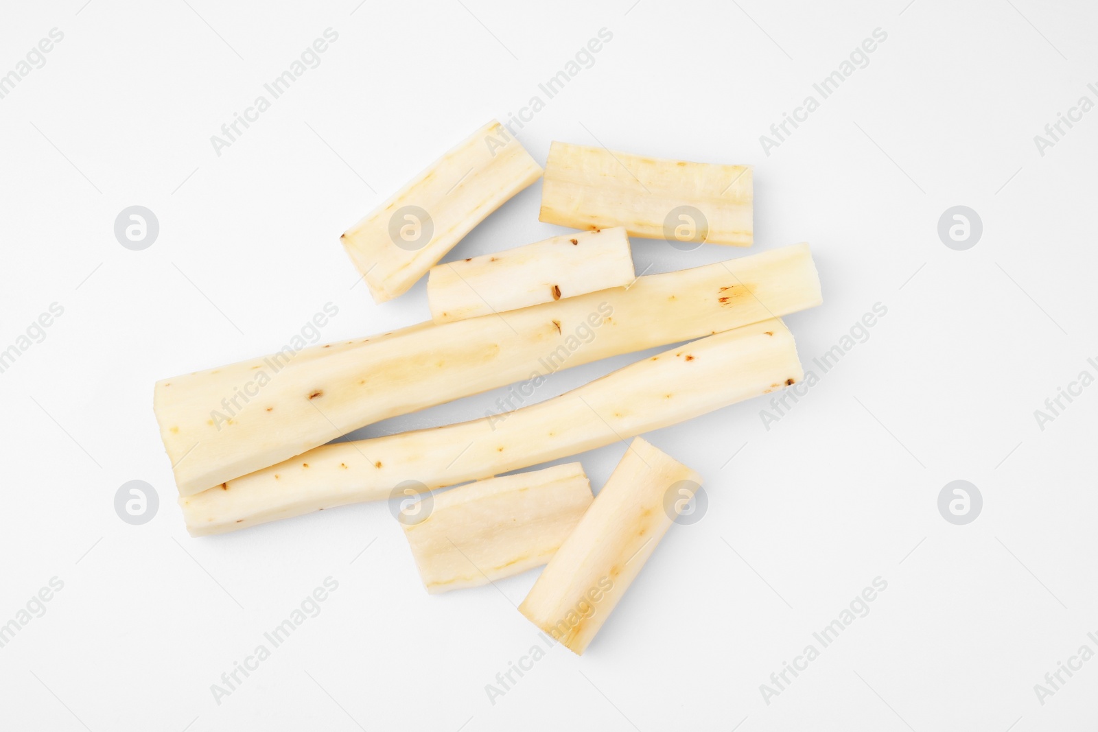 Photo of Cut raw salsify roots on white background, flat lay