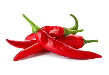 Photo of Heap of red chili peppers on white background