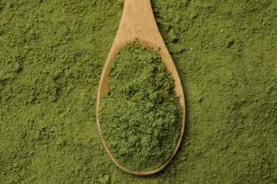 Spoon and green matcha powder, top view