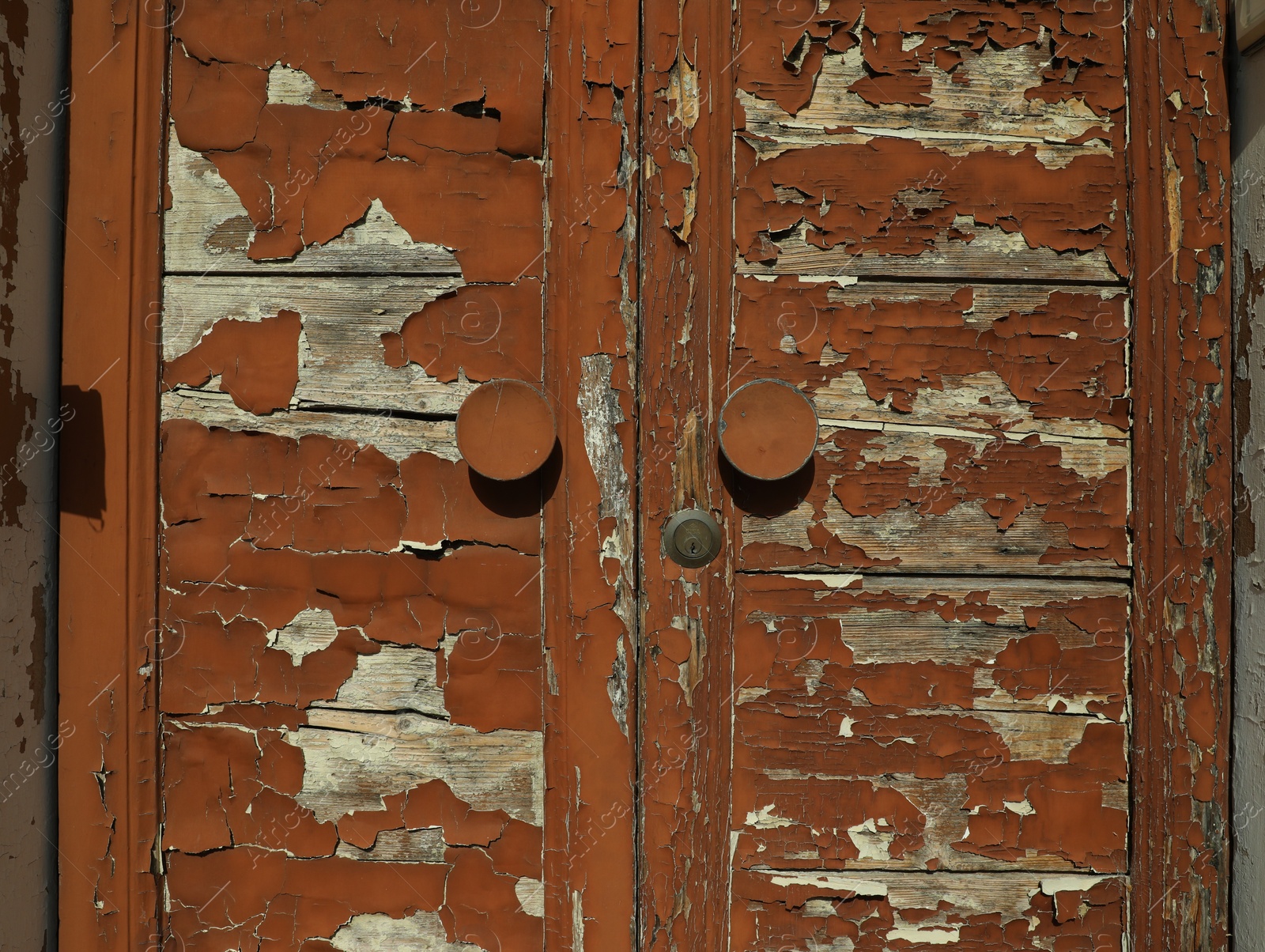 Photo of Old door with shabby paint outdoors, closeup